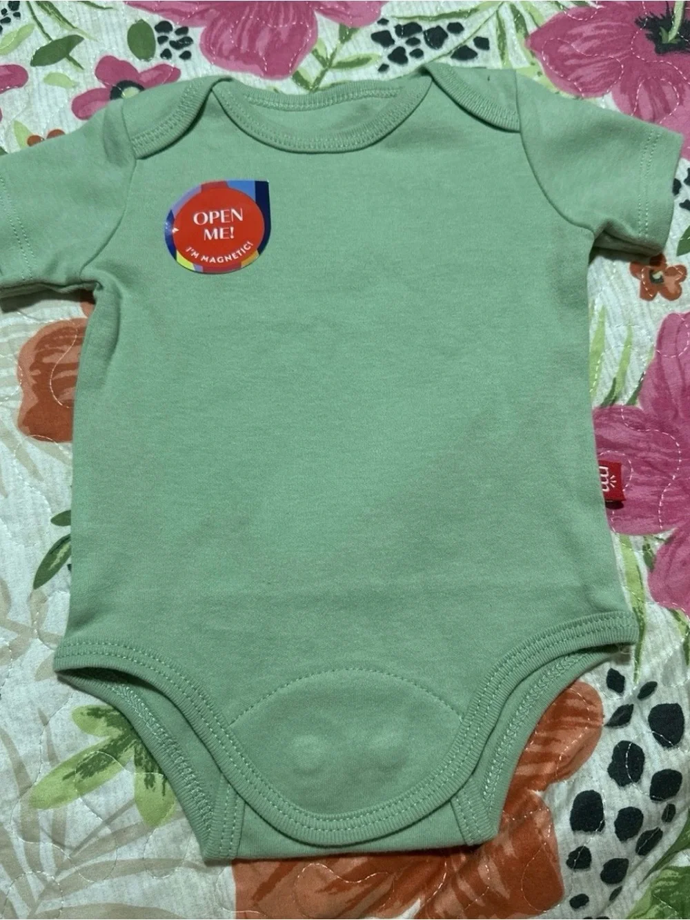 Magnetic Me Baby One-Piece Bodysuits in Sage, Cream, White, and Moon Print Newbo